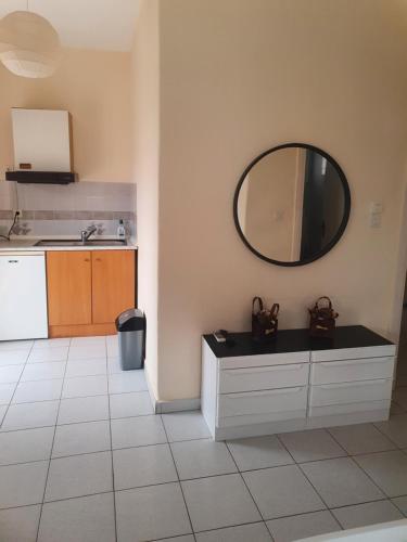 a bathroom with a mirror and a sink and a counter at Chris -Nikol STUDIO in Kallithea Halkidikis