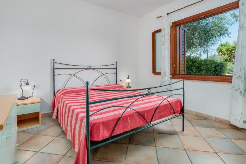 Llit o llits en una habitació de Villetta Bifamiliare
