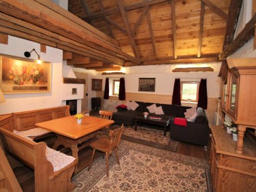 a living room with a table and a couch at Holiday Home Move on Ranch by Interhome in Neustift bei Güssing