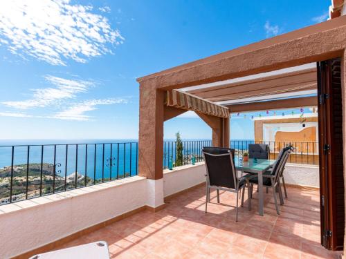 a patio with a table and chairs on a balcony at Apartment Azul Celeste by Interhome in Benitachell