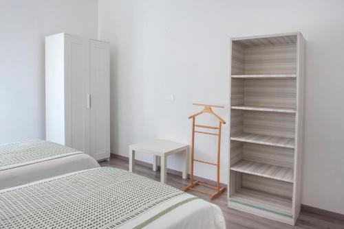Ліжко або ліжка в номері A11 - Varano, delizioso trilocale con giardino