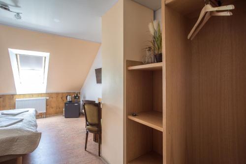 a bedroom with a bed and a room with a closet at Pärnu Villa Harmony in Pärnu