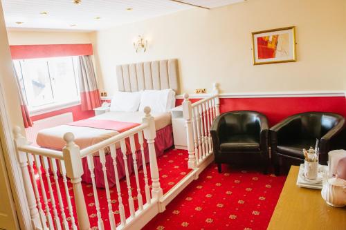 Ein Bett oder Betten in einem Zimmer der Unterkunft Doric Hotel