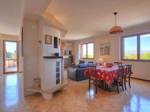 a kitchen and living room with a table and chairs at Villa Smeraldo by Interhome in Siracusa