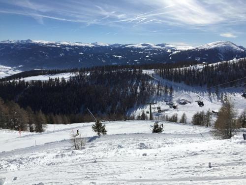 a snowy mountain with a ski lift in the distance at Haus Greet in Muhr