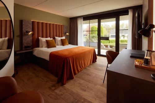 Postel nebo postele na pokoji v ubytování Van der Valk Hotel Dennenhof