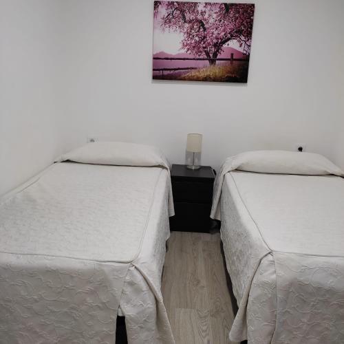 Cama o camas de una habitación en Hostal Castilla