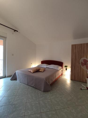 a bedroom with a large bed in a room at Summer vibe in Vir