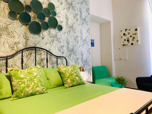 Ένα ή περισσότερα κρεβάτια σε δωμάτιο στο Sogno Botanico