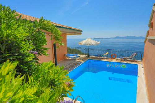 a swimming pool with a view of the ocean at Mare Vista Ariadni in Nisakion