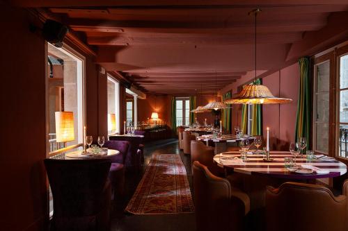 a row of tables and chairs in a restaurant at chic&basic Habana Hoose in Barcelona