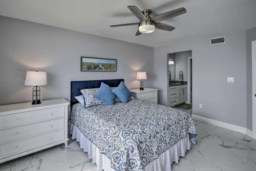 a bedroom with a bed and a ceiling fan at Oceanfront Ormond Beach Condo - Steps to Shore! in Ormond Beach