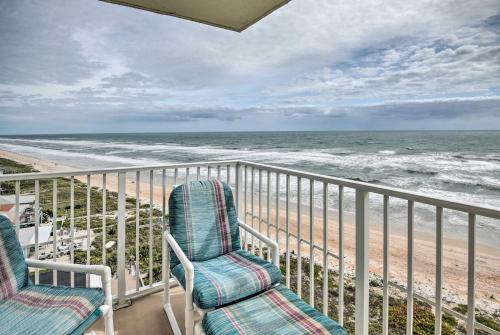 two chairs on a balcony overlooking the beach at Oceanfront Ormond Beach Condo - Steps to Shore! in Ormond Beach
