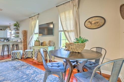a kitchen and dining room with a table and chairs at Bayou La Batre Stilted House on Snake Bayou! in Bayou La Batre
