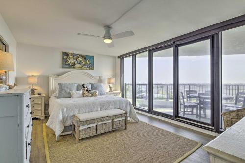 a bedroom with a bed and a large window at Panoramic Gulf Views Port Aransas Condo! in Port Aransas