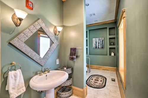 a bathroom with a sink and a mirror at Vast McArthur Home Near Wayne National Forest in Hamden
