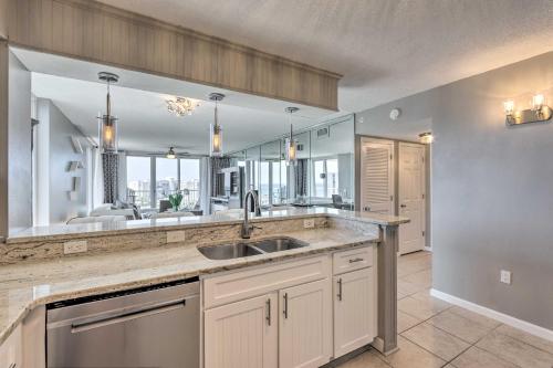 a kitchen with a sink and a large mirror at The Terrace at Pelican Beach Resort: View + Pool! in Destin