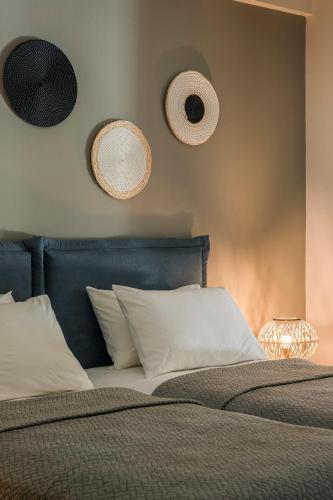 a bedroom with a bed with two speakers on the wall at Emily Villas in Sami