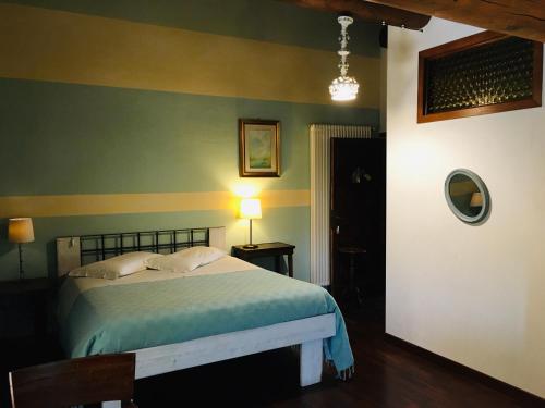 Postel nebo postele na pokoji v ubytování B&B Ai Tre Confini