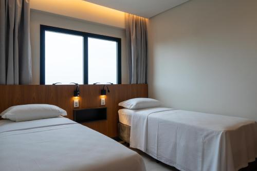 Katil atau katil-katil dalam bilik di Salinas Premium Resort