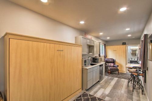 a kitchen with a large wooden cabinet in a room at Steps to Foothills Trail Unique Carbonado Studio in Buckley