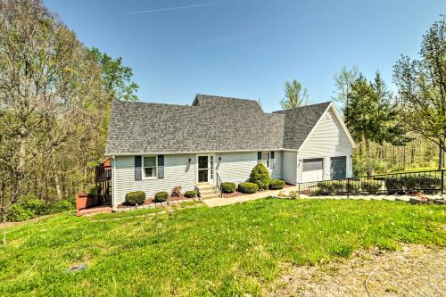 a white house with a gambrel roof at Cadiz Abode with Decks, Fire Pit, and Lake Access in Cadiz