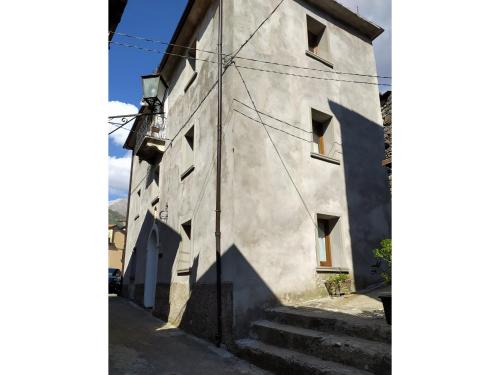 a building with stairs leading up to it at Casa Vacanze Al Colletto - Con terrazza panoramica in centro storico in Vagli di Sotto