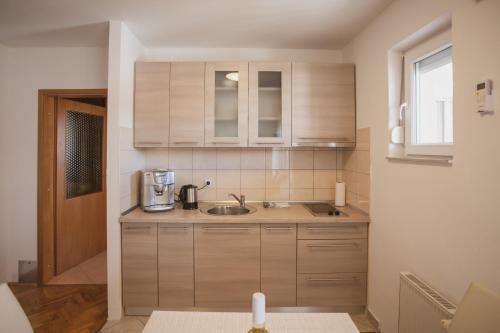 a kitchen with a sink and a mixer in it at Plava Adria Podstrana in Podstrana