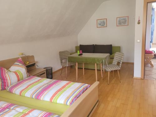 a living room with a couch and a table at Appartement Pölzl Öblarn Region Schladming Dachstein in Öblarn