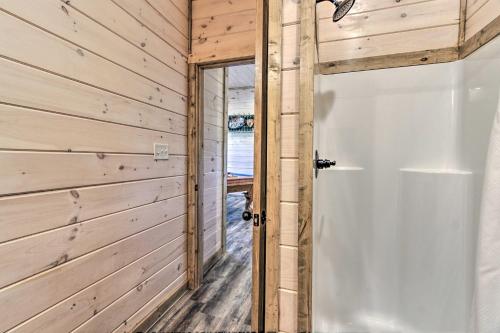 a door to a cabin with a view of the ocean at 'Madison Bear Garden' 7Bdr w/Hot Tub + Pool Access in Pigeon Forge