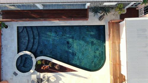 a swimming pool on the side of a house at Bourbon Horizon in La Possession