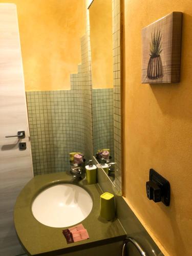 a bathroom with a sink and a mirror at Rizzi Marianna B&B in Monopoli
