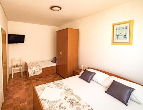 Postel nebo postele na pokoji v ubytování Apartments M&S