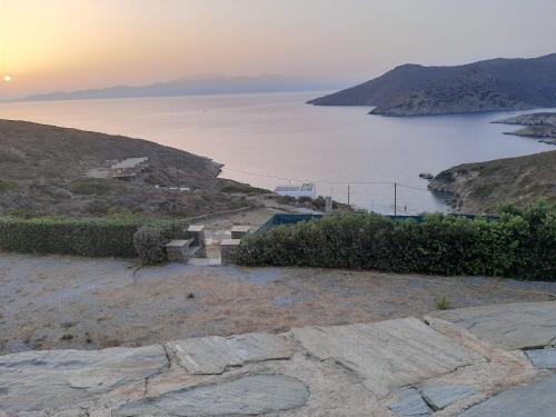 a view of a body of water at sunset at Andros Eco Home in Gavrion