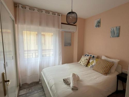 Posteľ alebo postele v izbe v ubytovaní Alicante(Santa Pola), Bord de plage, 3 chambres