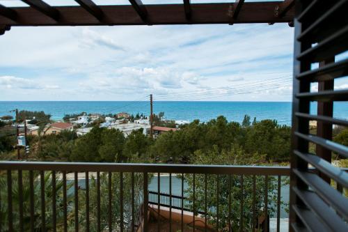 a view of the ocean from a balcony at Seaclusion Vacation Villa in Pomos