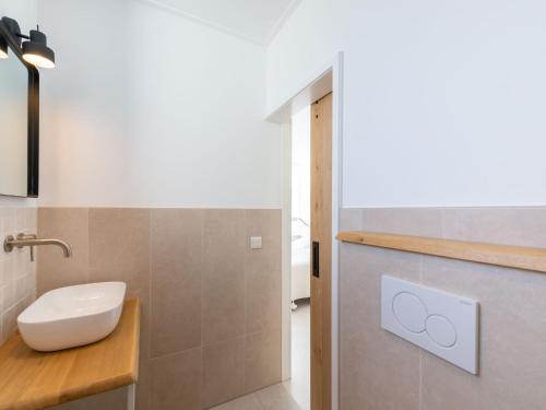 a bathroom with a sink and a toilet in it at Holiday Home near Dutch Beach and Nature in Oostkapelle
