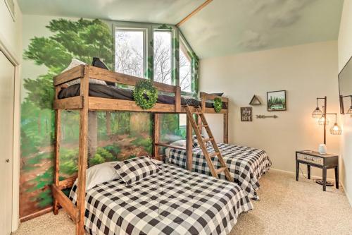 a bedroom with two bunk beds and a mural at Eureka Springs Gem 2 Decks, Mtn and Lake Views in Golden