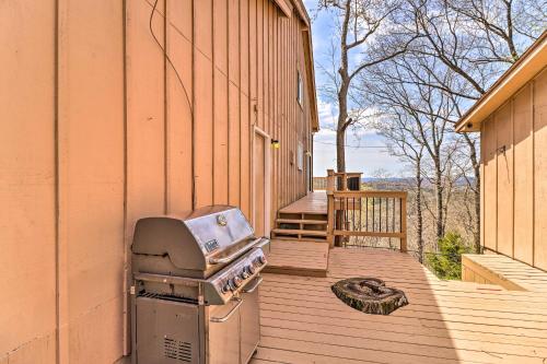 a grill sitting on a deck next to a building at Eureka Springs Gem 2 Decks, Mtn and Lake Views in Golden