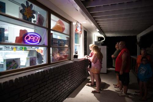 a group of people standing outside of a fast food restaurant at Pine Haven in Cape May Court House