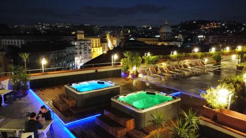 a hotel rooftop with two hot tubs on a roof at B&B Sweet Sleep in Naples