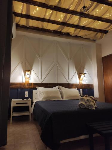 En eller flere senge i et værelse på Poseidon Rooms