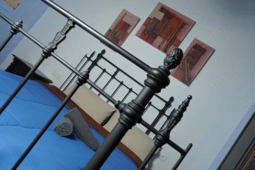 a close up of a bed with a metal pole at Mascotas 1 in Benaocaz