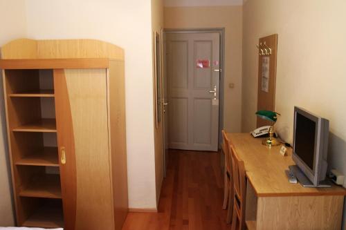a room with a desk with a computer on it at Hotel Graf Stadion in Vienna