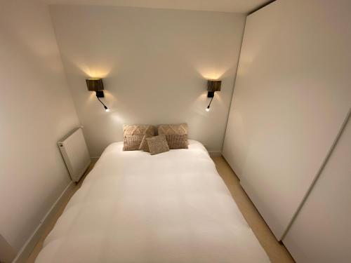 Säng eller sängar i ett rum på Nieuwpoort in 't zonneke - appartement met terras