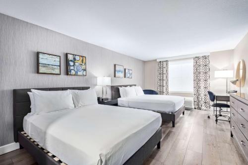 Säng eller sängar i ett rum på Fountain Park Hotel BW Signature Collection