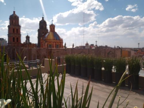 a view of a city with buildings in the background at Gran Hotel Concordia San Luis Potosi in San Luis Potosí
