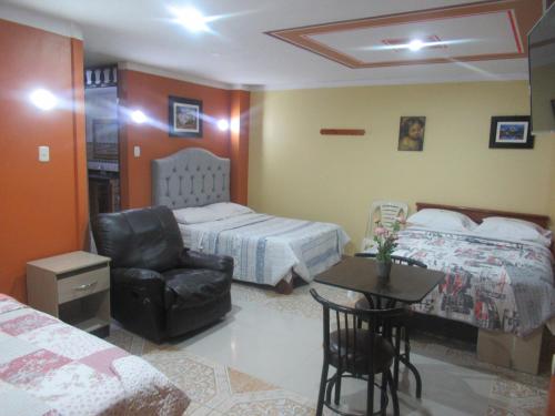 Ένα ή περισσότερα κρεβάτια σε δωμάτιο στο Gran Hostal Los Pinos