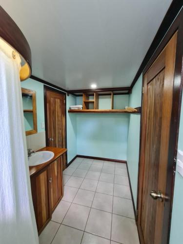 a bathroom with a sink and a toilet at Casa Numú in Cahuita