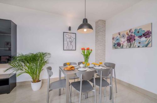 a dining room with a table and chairs at Apartment in Malinska Insel Krk 13004 in Malinska